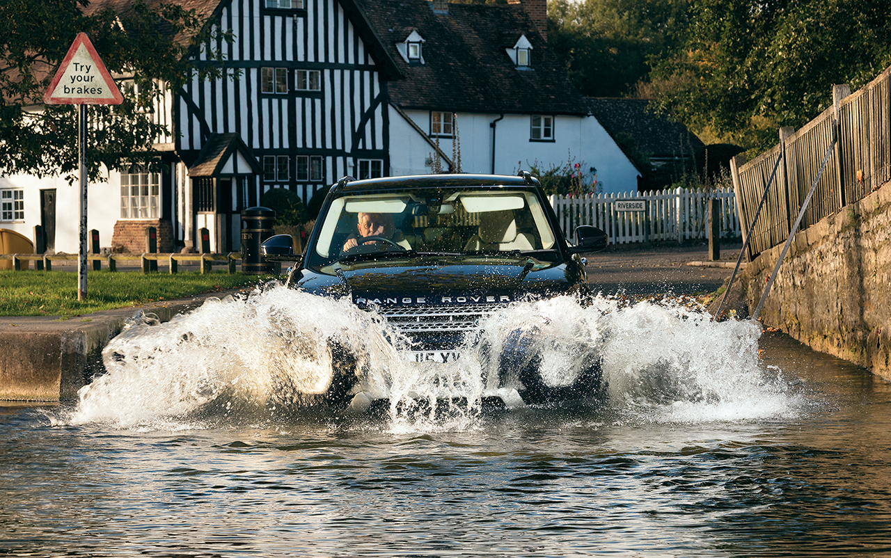 Range Rover Evoque splashing through Eynsford ford by automotive car photographer Darren Woolway
